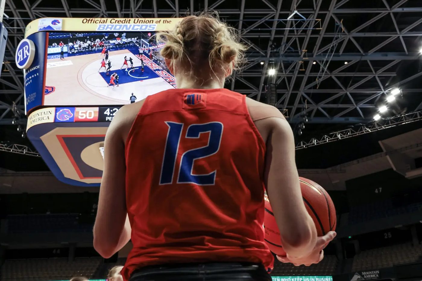 Boise State women's basketball player at the scoreboard